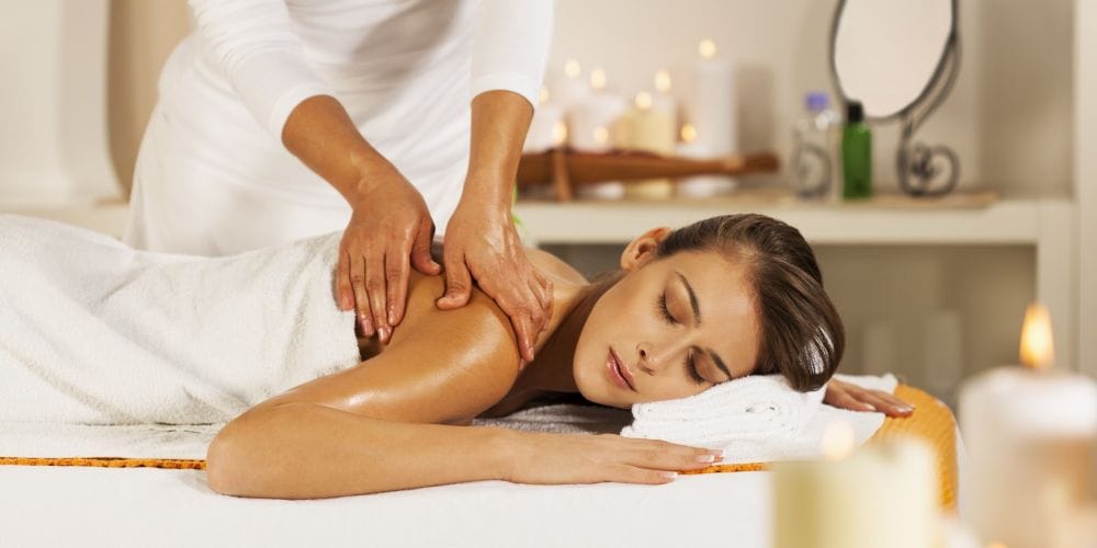 Woman receiving a massage at a massage studio.