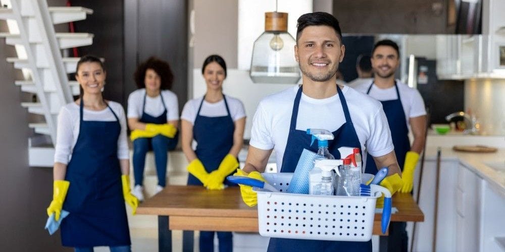 Cleaning crew ready to start cleaning a home.